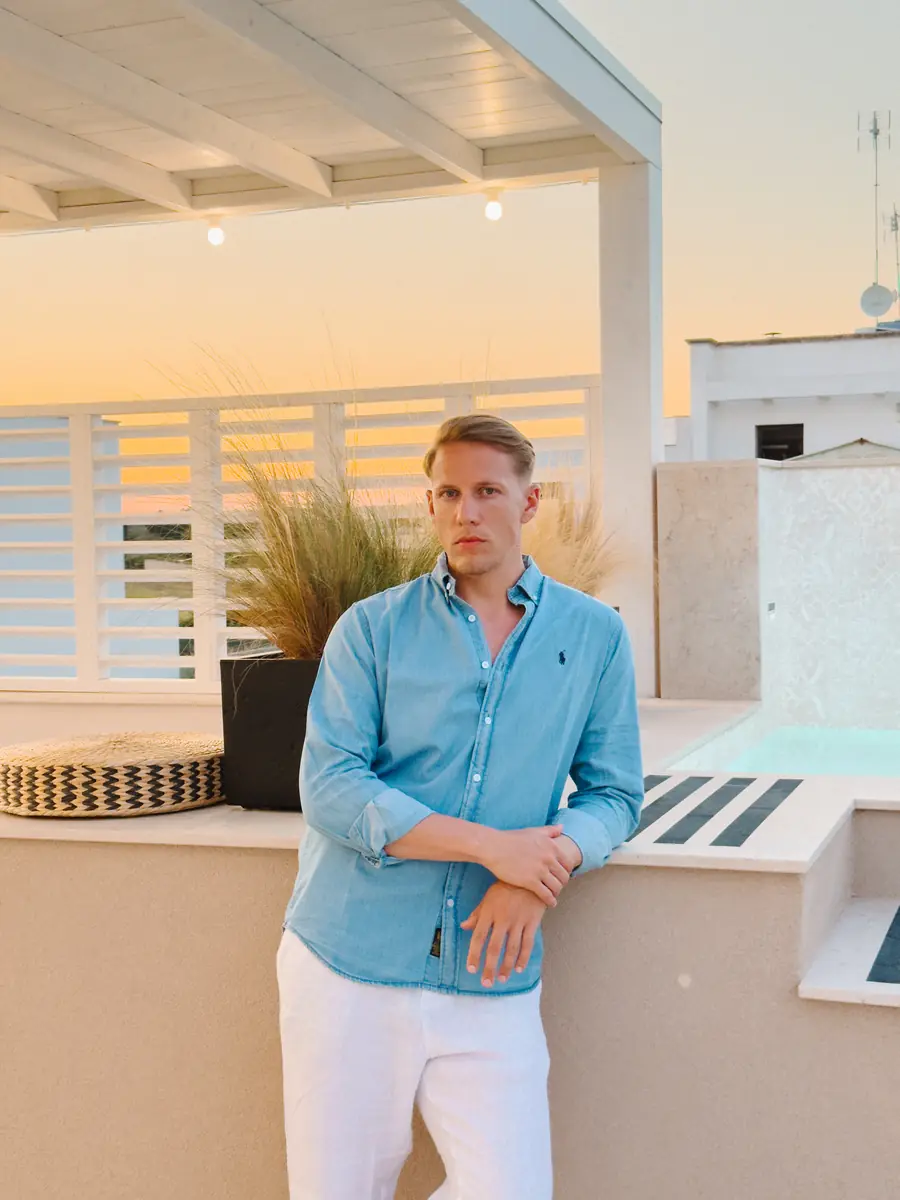 Beni on a rooftop terrace at sunset